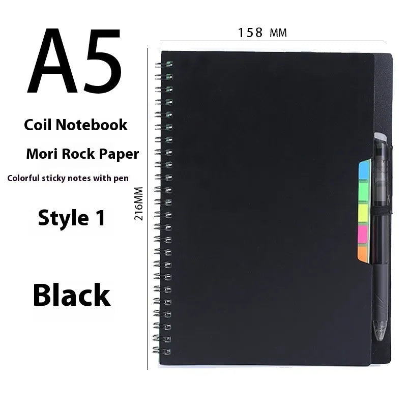 Erasable coil notebook with customisable cover options on waterproof rock stone paper, shown with pen.