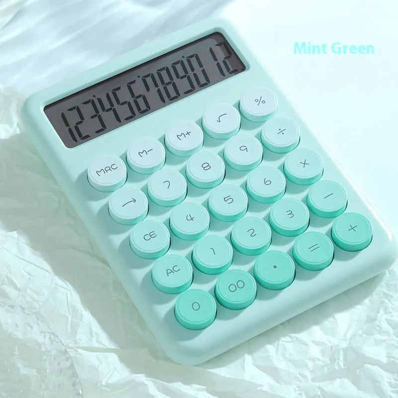 Gradient colour desktop calculator in four colour options on desk
