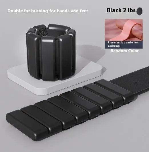Silicone fitness bracelet with Velcro strap shown in black, a detachable wrist weight for training.