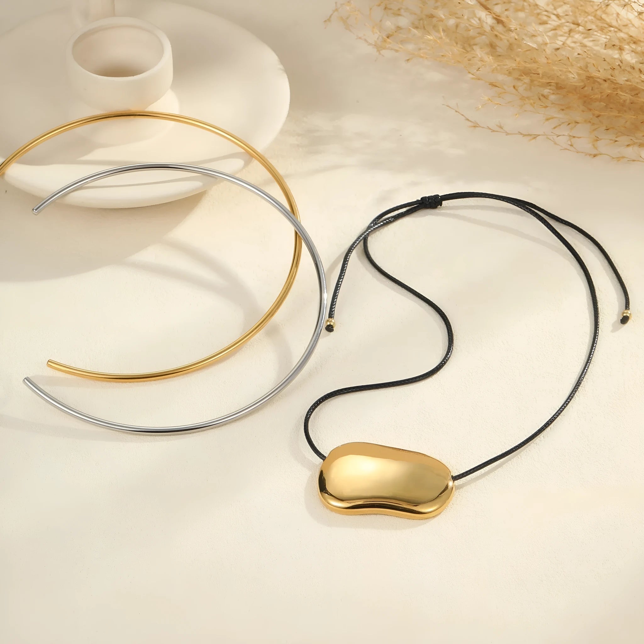 Stainless steel geometric pendant necklace with adjustable rope chain in gold or silver electroplated finish