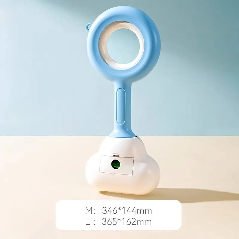 Blue cloud shape jaw dog pooper scooper on a lawn