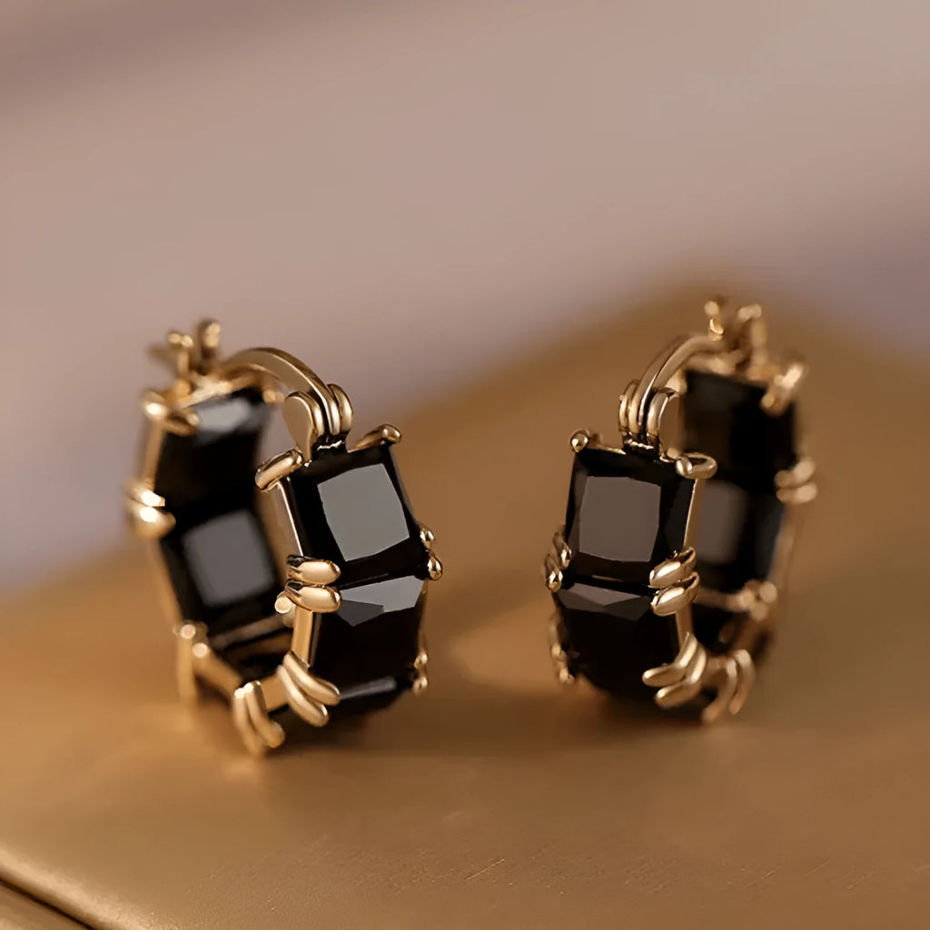 Gold electroplated copper earrings with geometric U-shape design and zircon crystals
