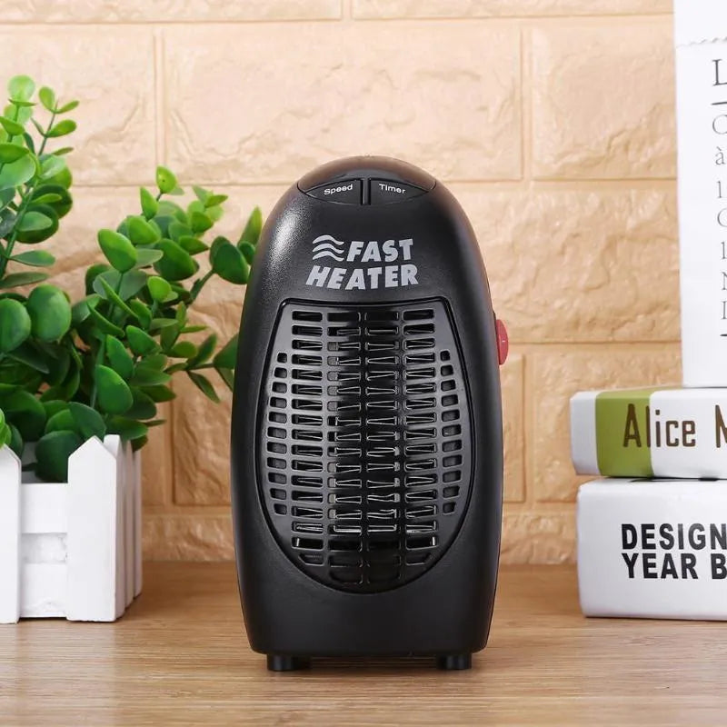 Black compact ceramic electric heater with digital display and rotating plug on a flat surface.
