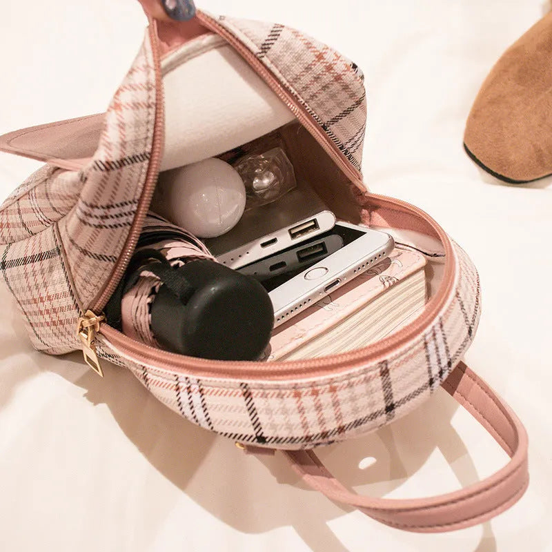 Diagonal one shoulder phone bag in PU fabric available in black, blue, brown, pink, and red colours.