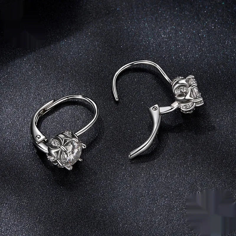 Sterling silver flower bud ear clips with moissanite centre stones and white gold plating