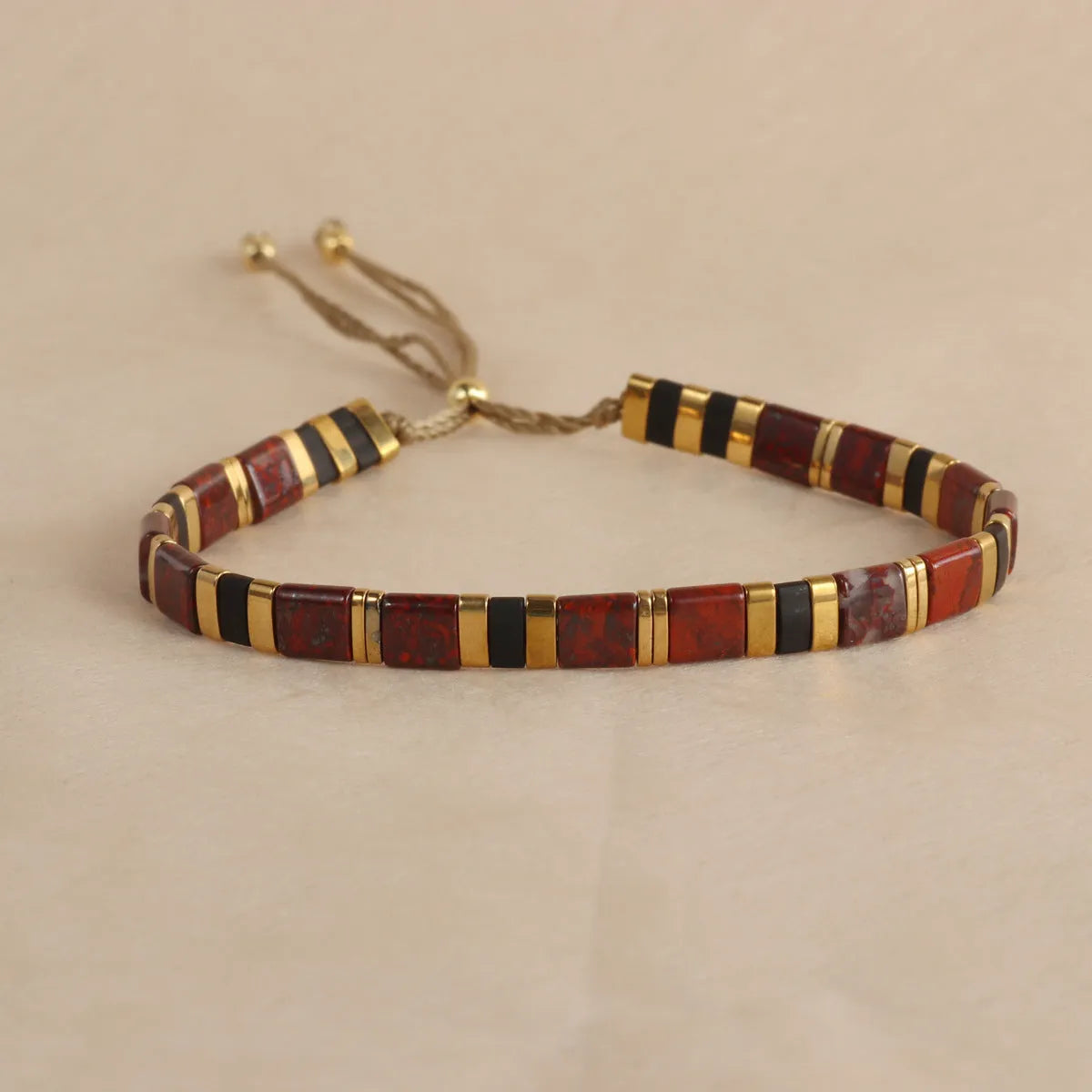 Geometric glass and coloured glaze beaded bracelet with round elements in five colour options