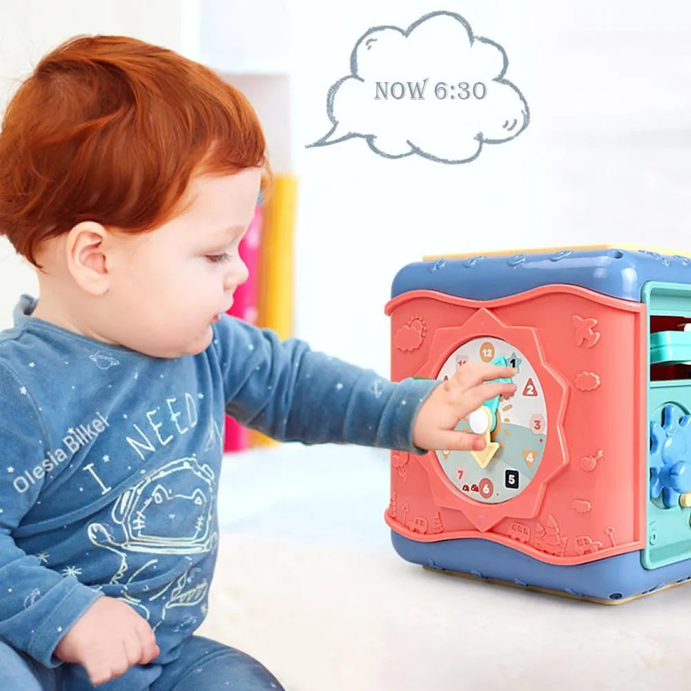 Multicoloured baby hexahedron educational toy cube showing bead maze, gear, and car maze activity faces