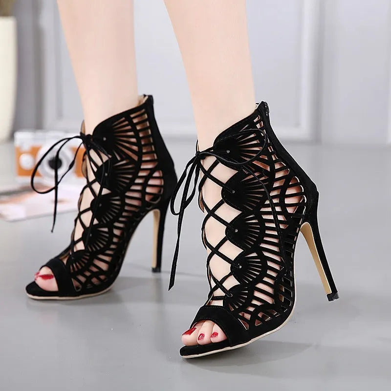 Black lace high heels with suede upper, fish mouth toe, stiletto heel above 8cm, and hollow design.