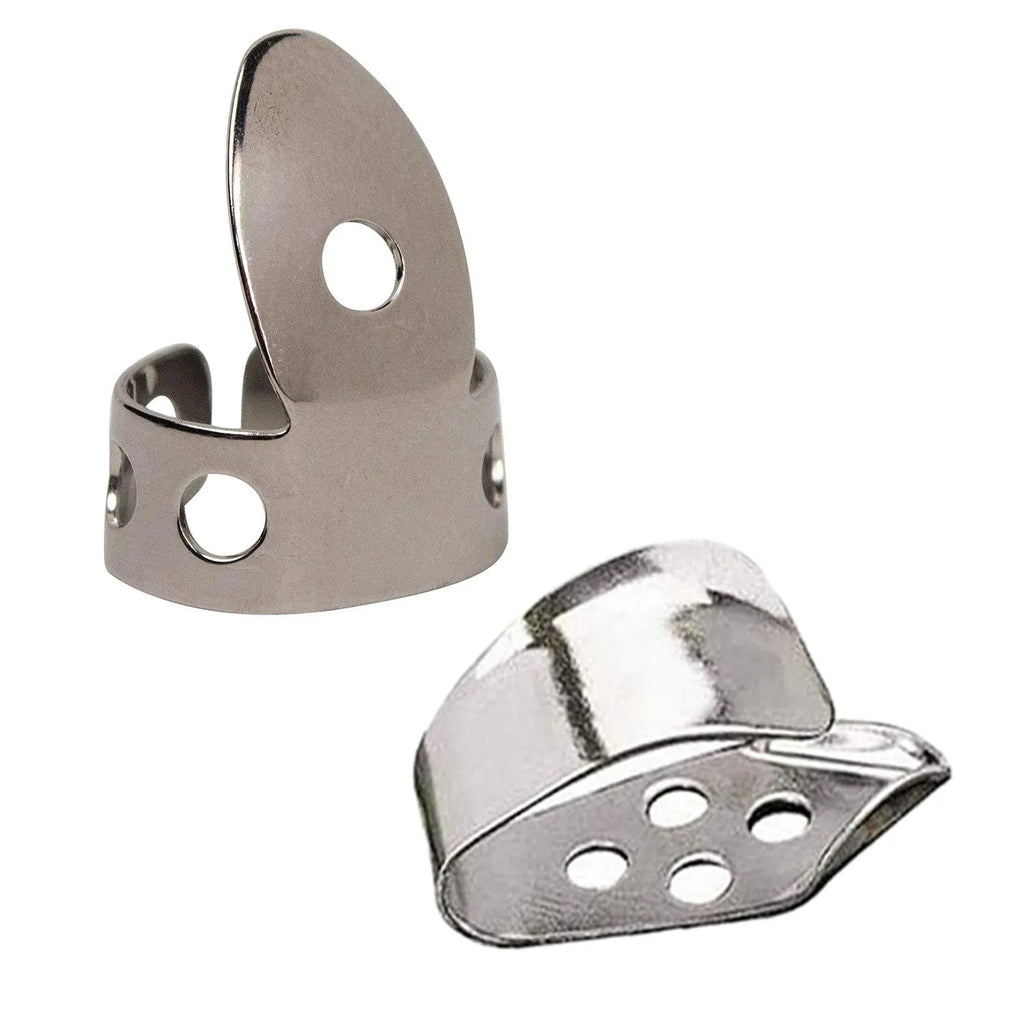 Four silver metal guitar finger stall plectrums laid flat on a surface