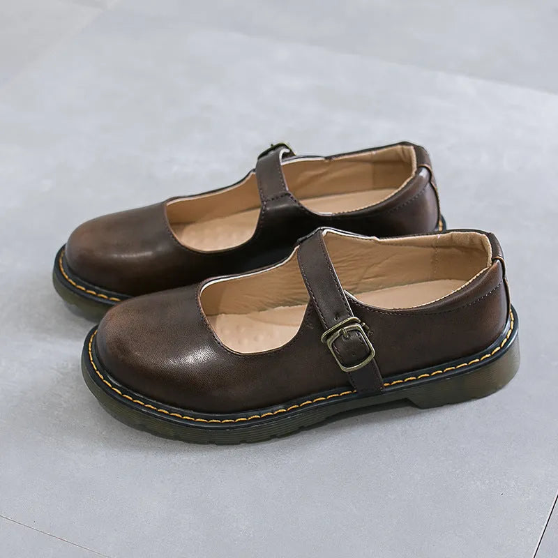 Women's solid colour round head low-cut flat retro shoes with buckle, black colour option, side view