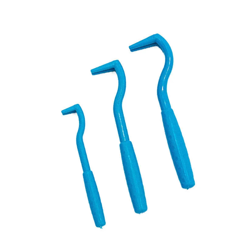 Three blue and green plastic pet tick removal hook tools on a white background.