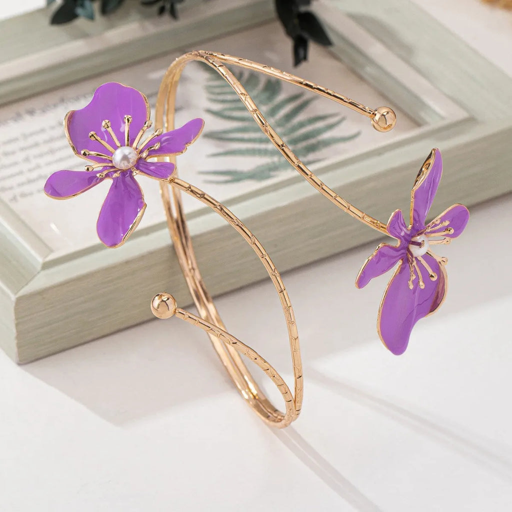 Alloy hollow armband bracelet with pattern lines shown in pink and purple colour options