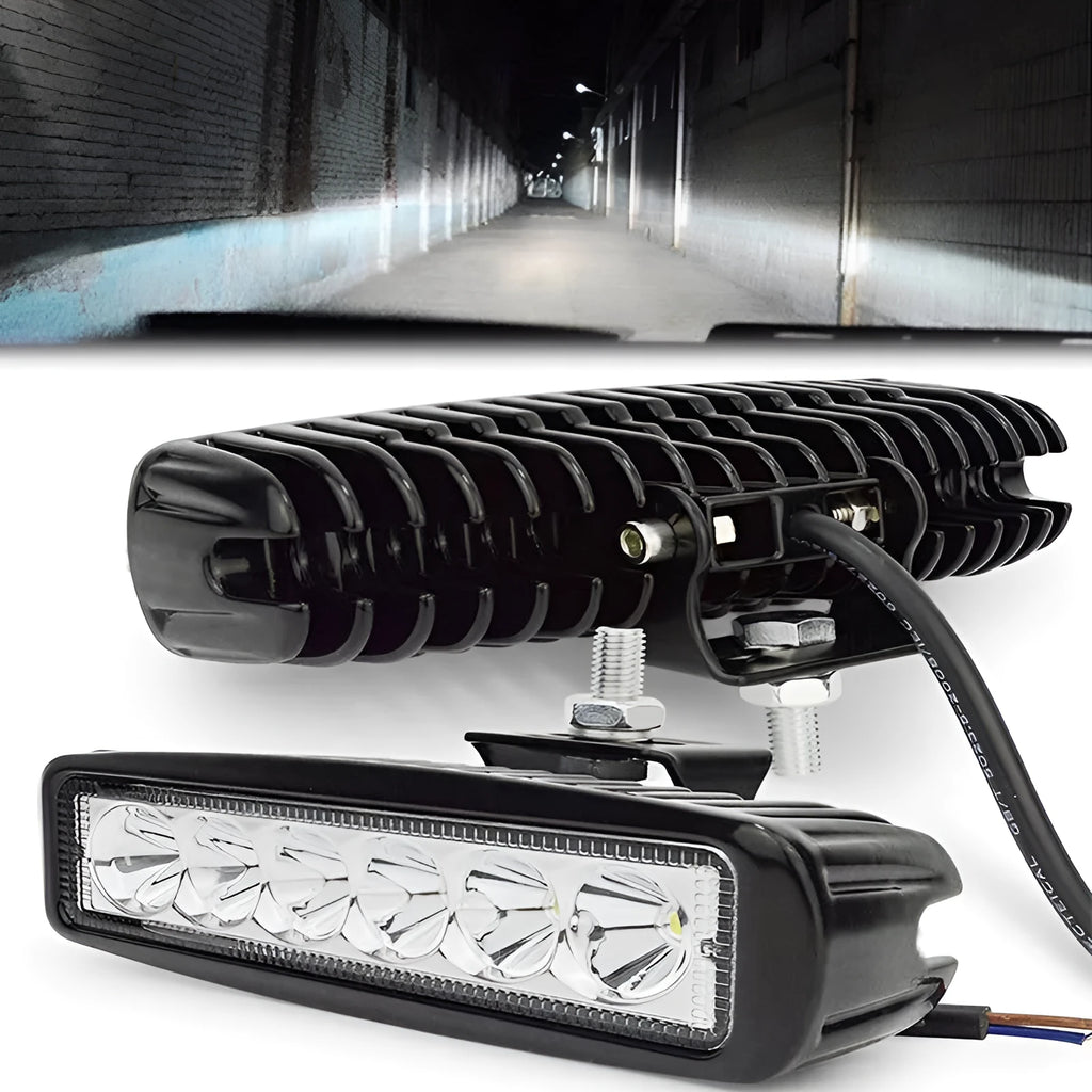 Black automotive auxiliary light with zigzag pattern on face, aluminium housing, and bracket mounting