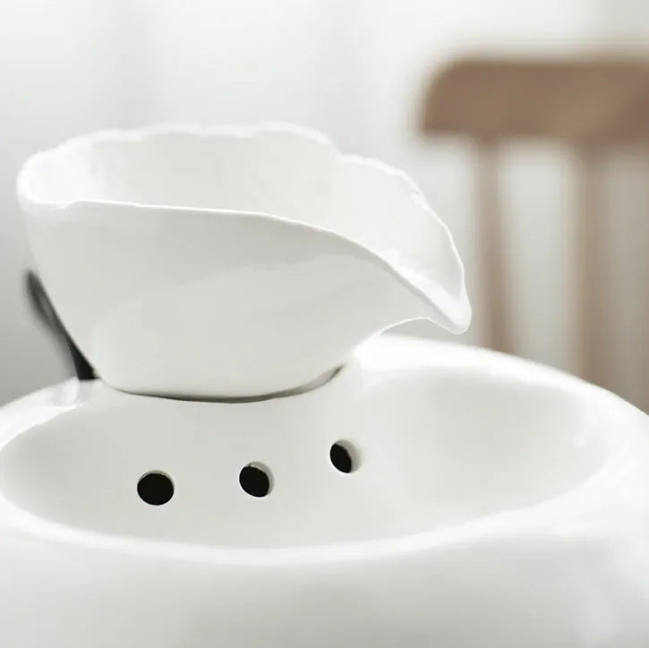 White ceramic automatic cat water dispenser with leaf-shaped bowl and pump