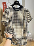 Black and white striped men's short sleeve loose fit pullover shirt on a hanger.