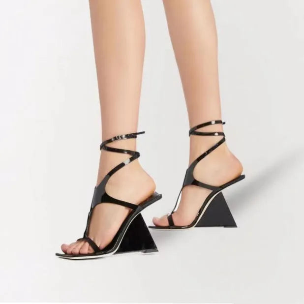Black women's strappy high heel sandals with a square toe and ankle buckle on a 9.5cm rubber heel.