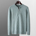 Man wearing a grey diamond pattern pure wool half zip sweater, loose fit with long sleeves.