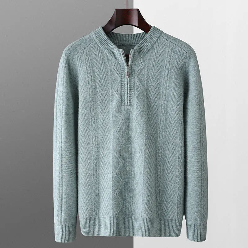 Man wearing a grey diamond pattern pure wool half zip sweater, loose fit with long sleeves.