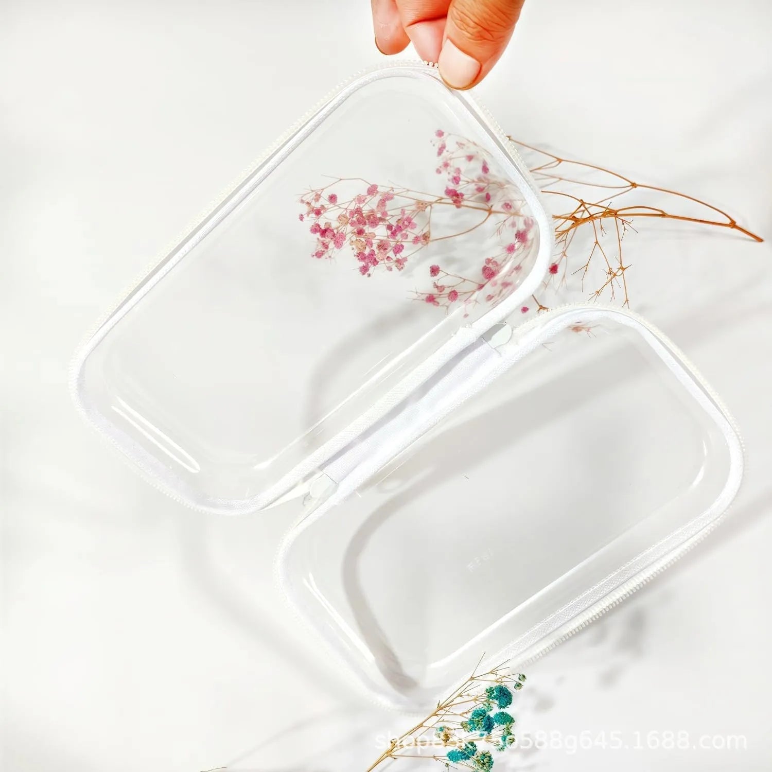 Transparent PET zipper storage bag in cube shape, showing contents through clear plastic