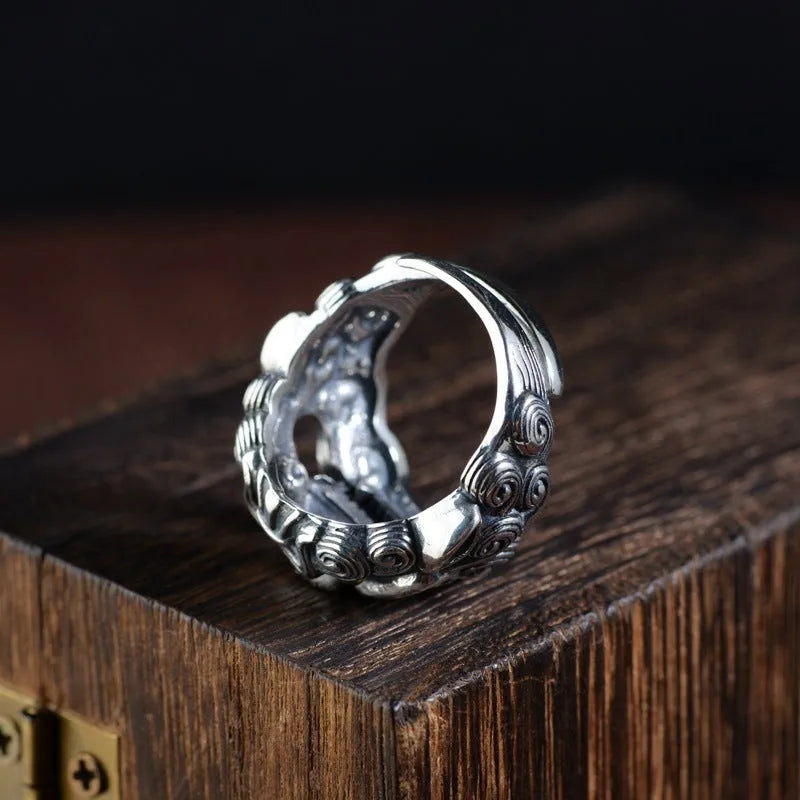Personalised Jibeast pattern open style silver diamond ring on a hand.