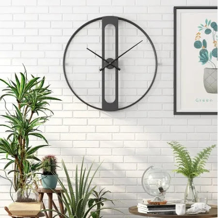Round metal wall clock measuring 50cm in diameter, available in black and gold colour options