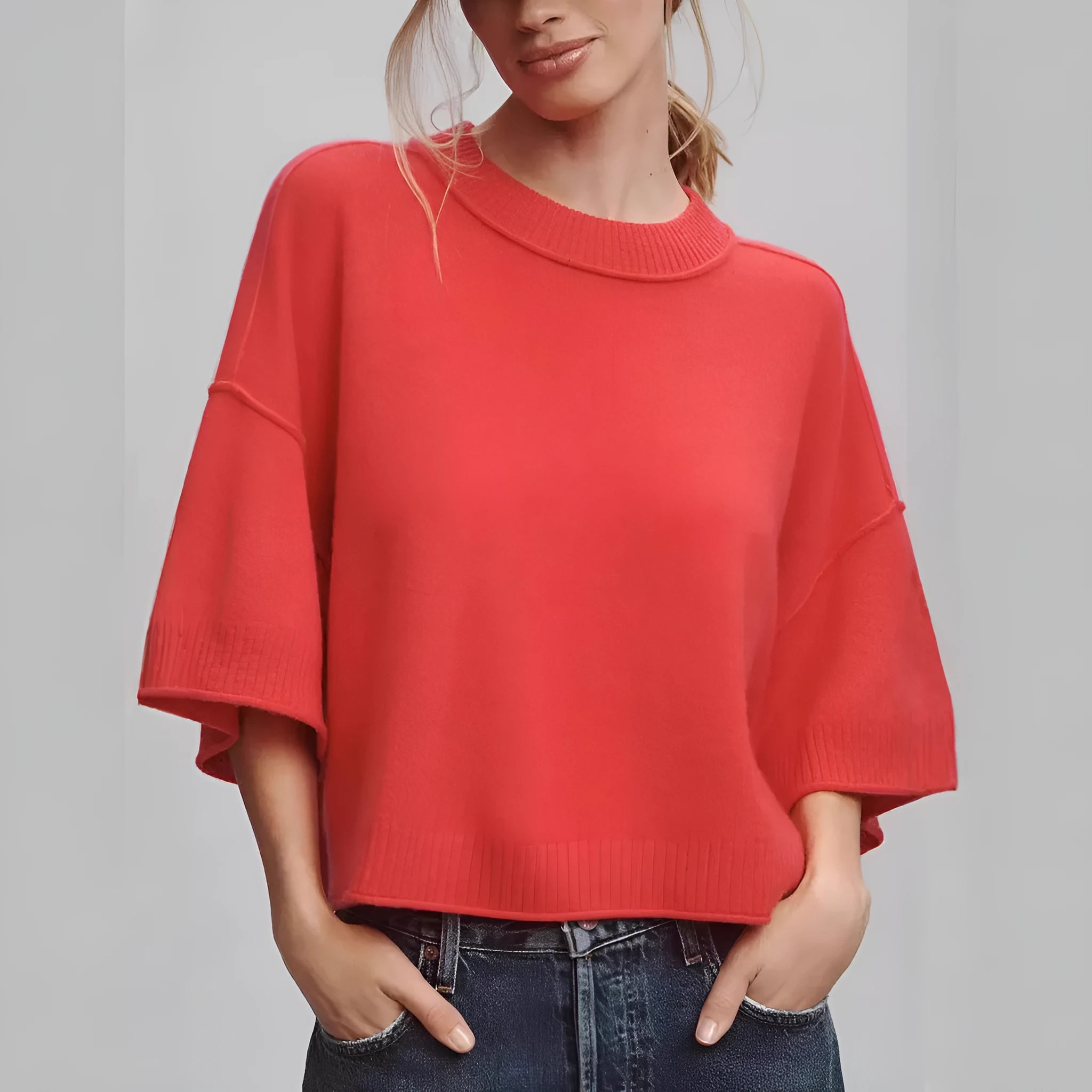 Red women's short viscose T-shirt with an exposed navel design on a model