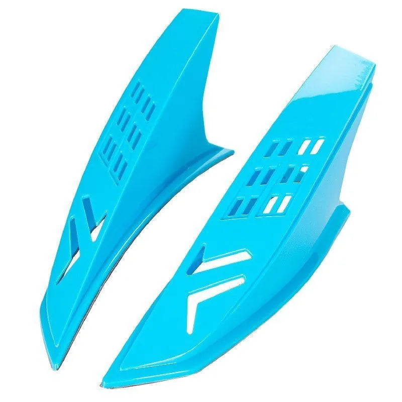 A pair of coloured helmet horns for child's motorcycle or ski helmet modification.
