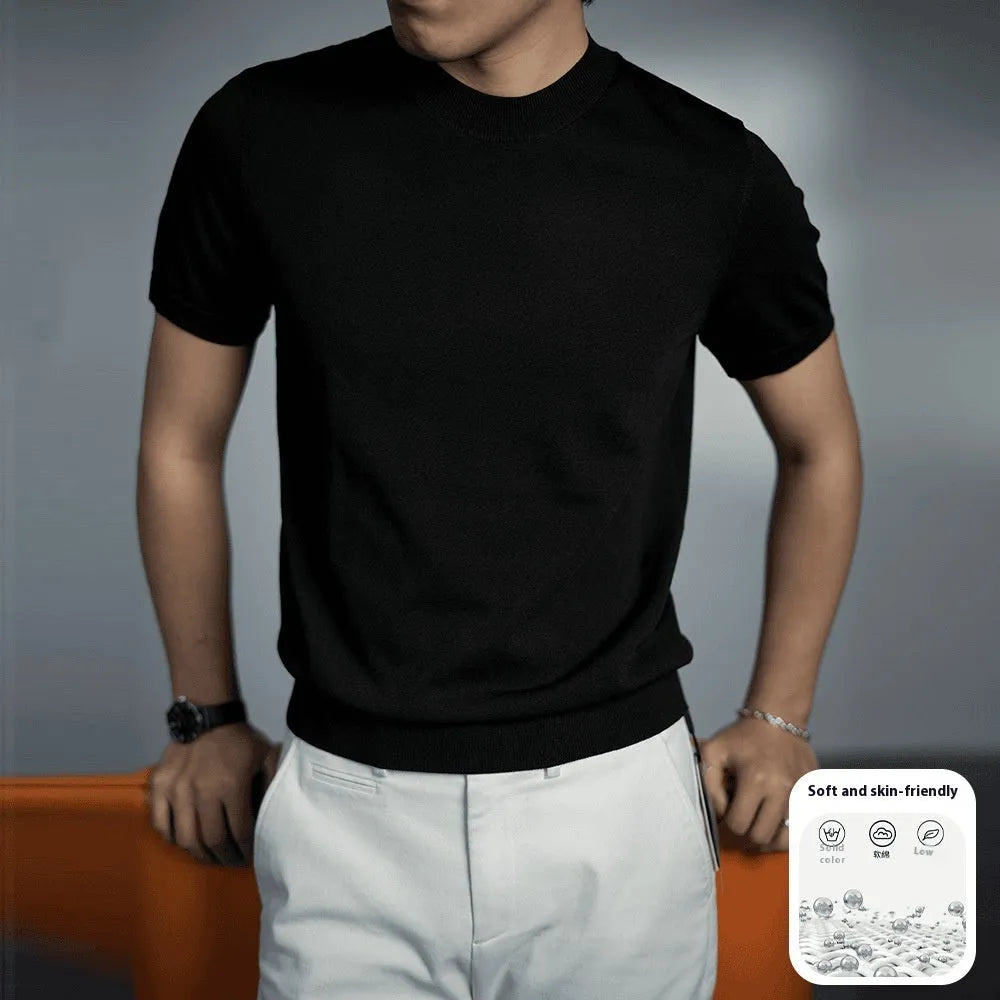 Man wearing a solid colour knitted business t-shirt with round neck and short sleeves.