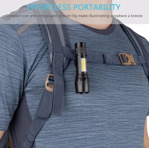 Black mini aluminium telescopic LED torch with pocket clip shown extended and retracted