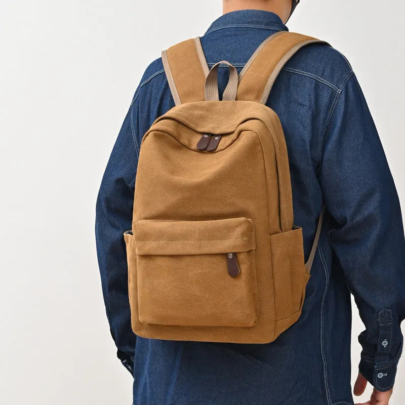 Canvas large capacity travel backpack in solid colour for men and women, available in brown