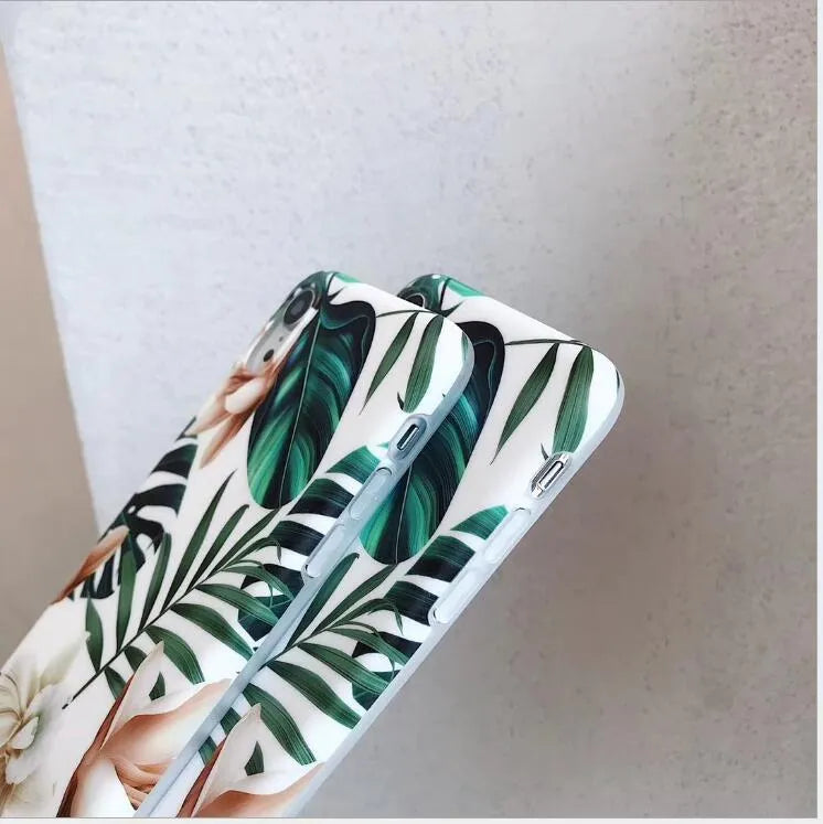Floral banana leaf art design on a soft TPU phone case for iPhone models.
