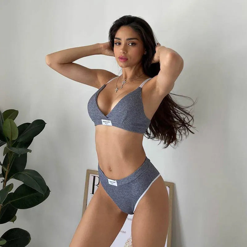Women's embroidered bikini set with contrast colour binding in polyester fabric showing sleeveless top and shorts-length bottoms