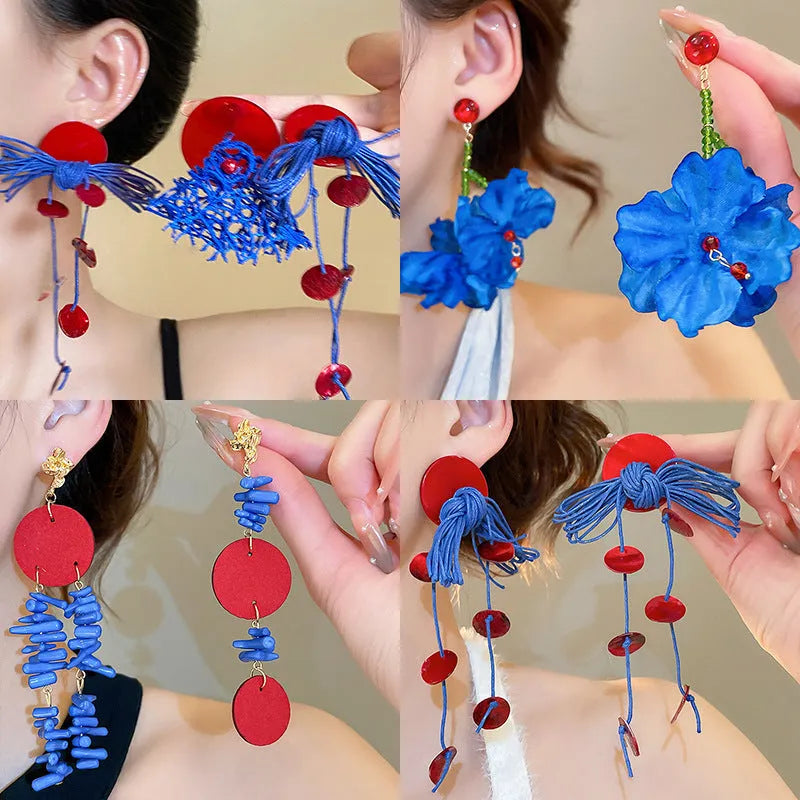 Women's geometric cloth earrings with silver needle and blue resin flower decorative details