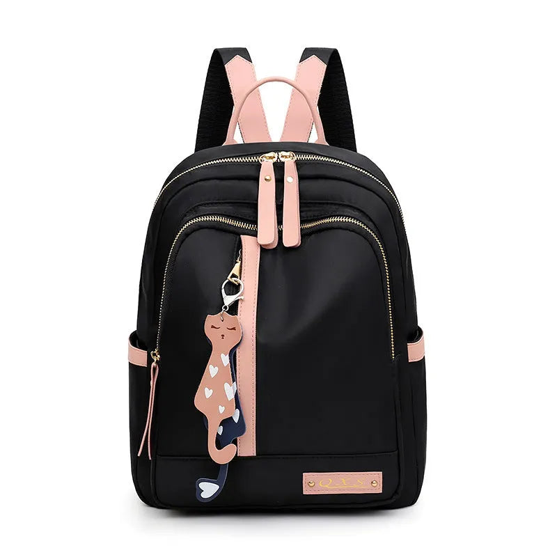 Women's black nylon backpack with square vertical shape showing internal compartments and shoulder straps