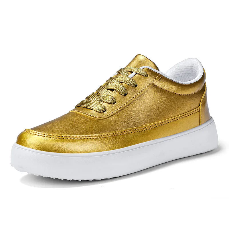 Women's white leather flat casual shoes with lace-up front on a plain background