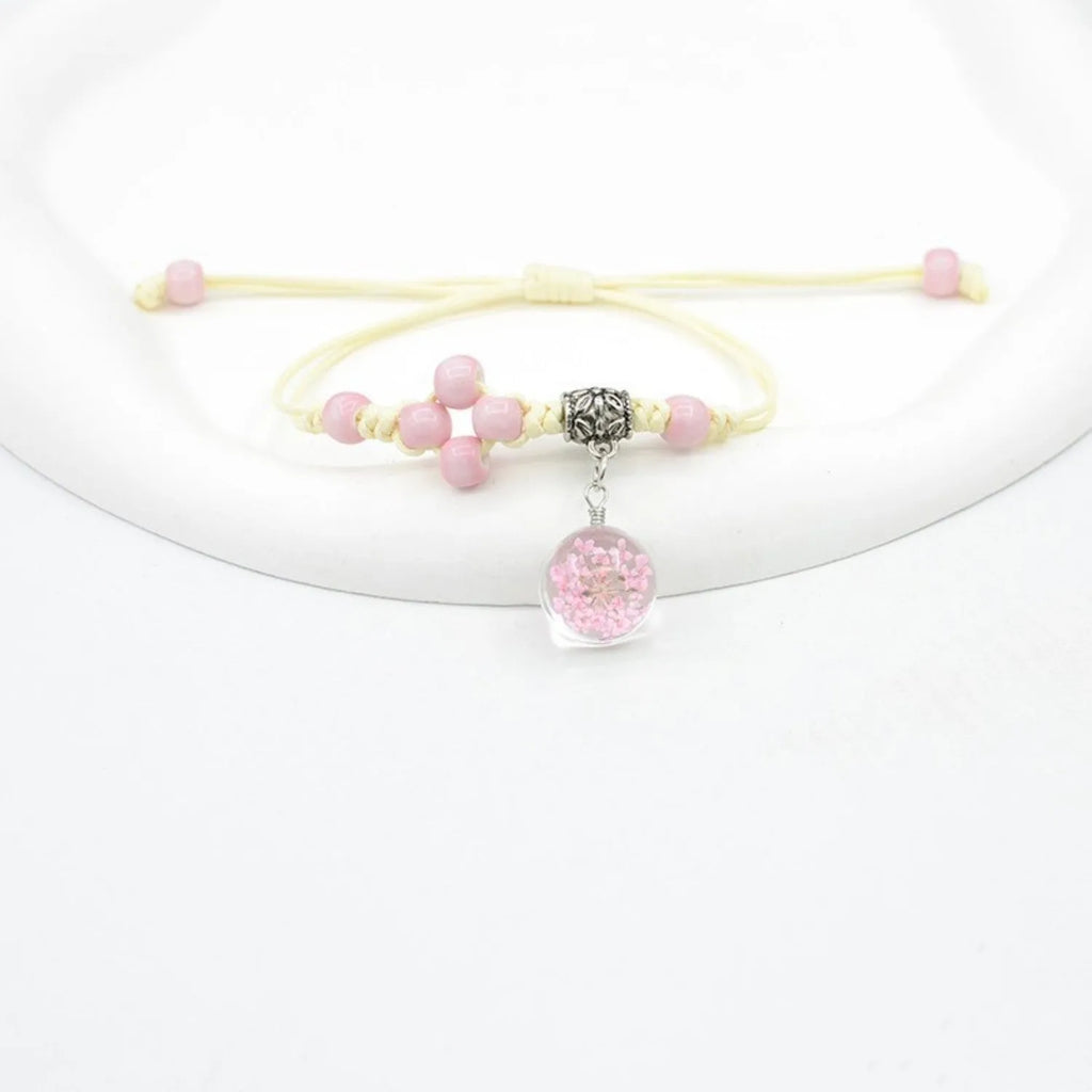 Glass bracelet with dried flowers inside 1.4cm beads on lace-style band in multiple colour options