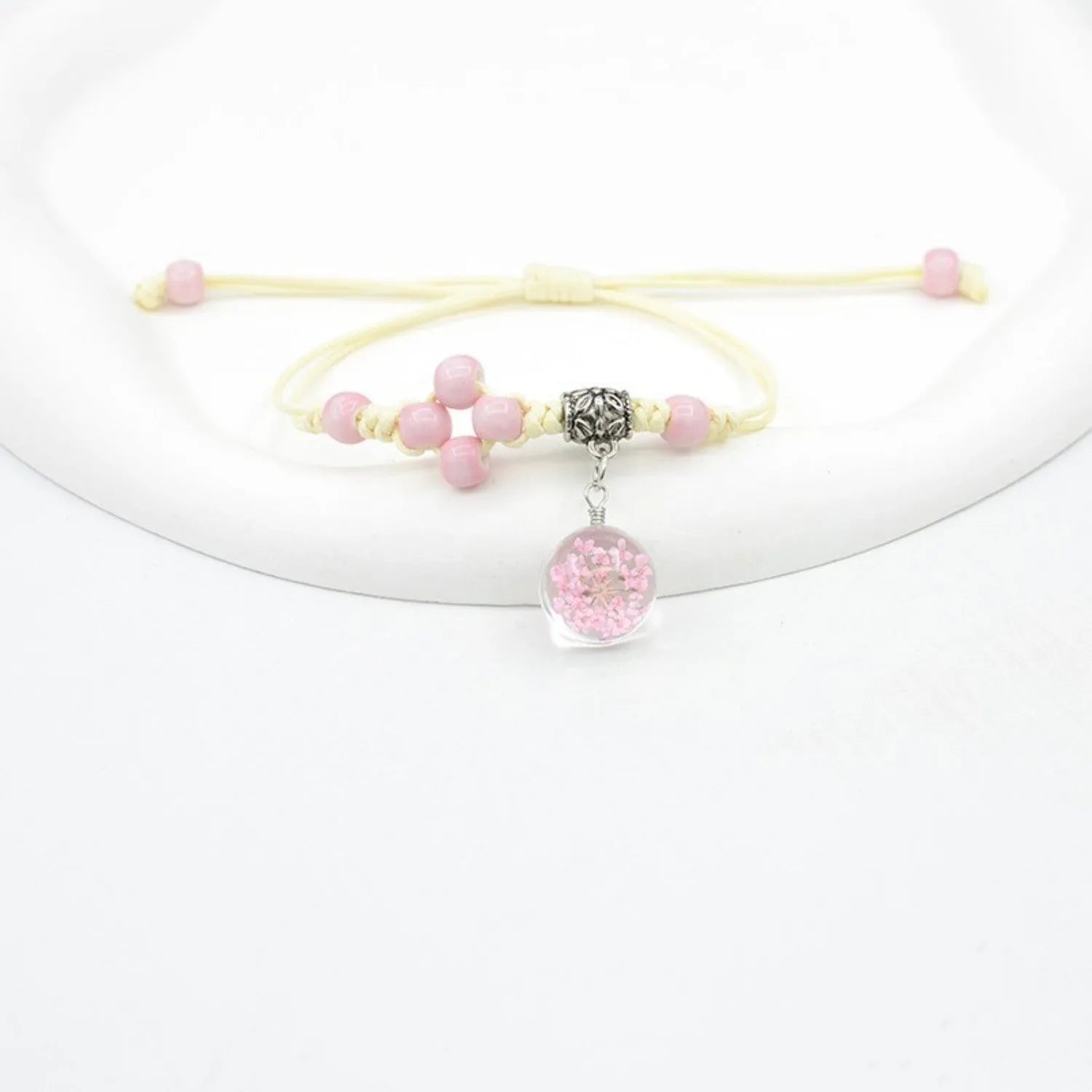 Glass bracelet with dried flowers inside 1.4cm beads on lace-style band in multiple colour options
