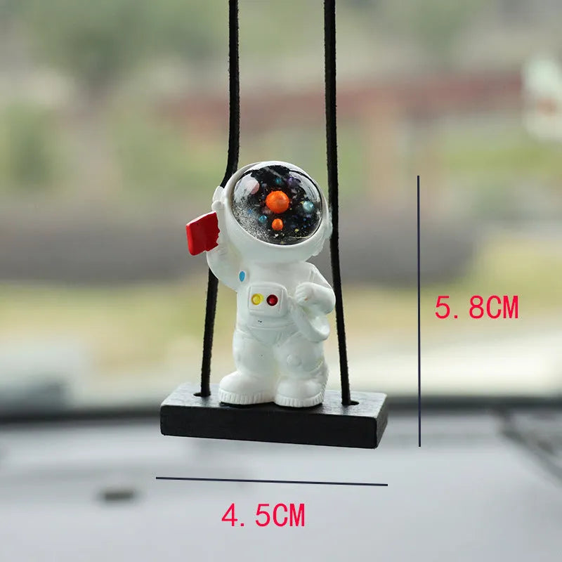 Cartoon astronaut resin pendant for car decoration, shown in various colour and style options.
