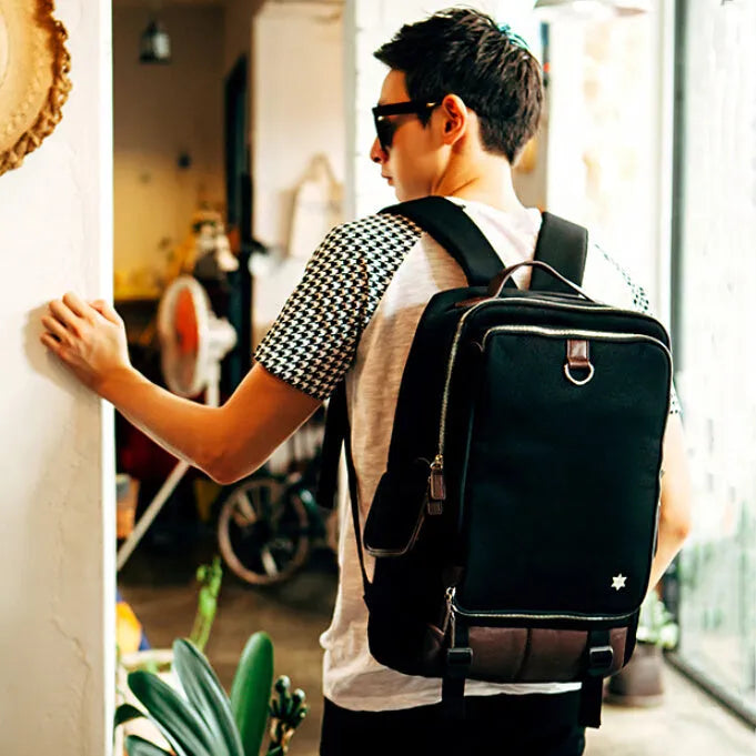 Men's modern Korean style backpack in Oxford cloth, showing large capacity and colour options.