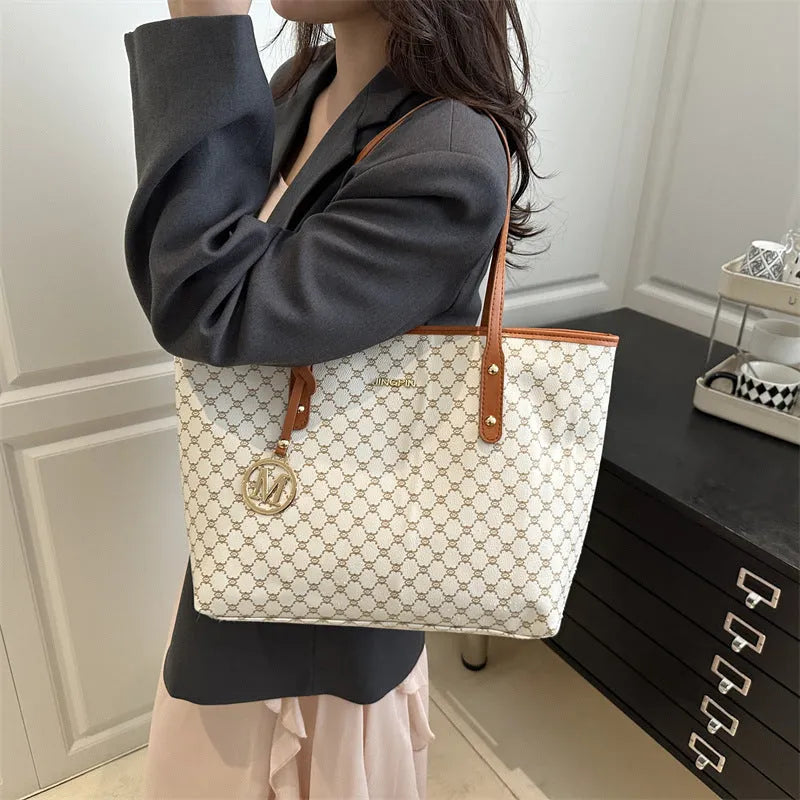 Women's structured PU leather shoulder bag with street trend sewing details shown in neutral colour options