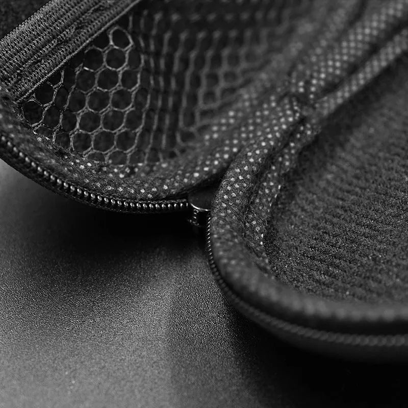 Black oval leather earphone storage bag with zip closure shown closed