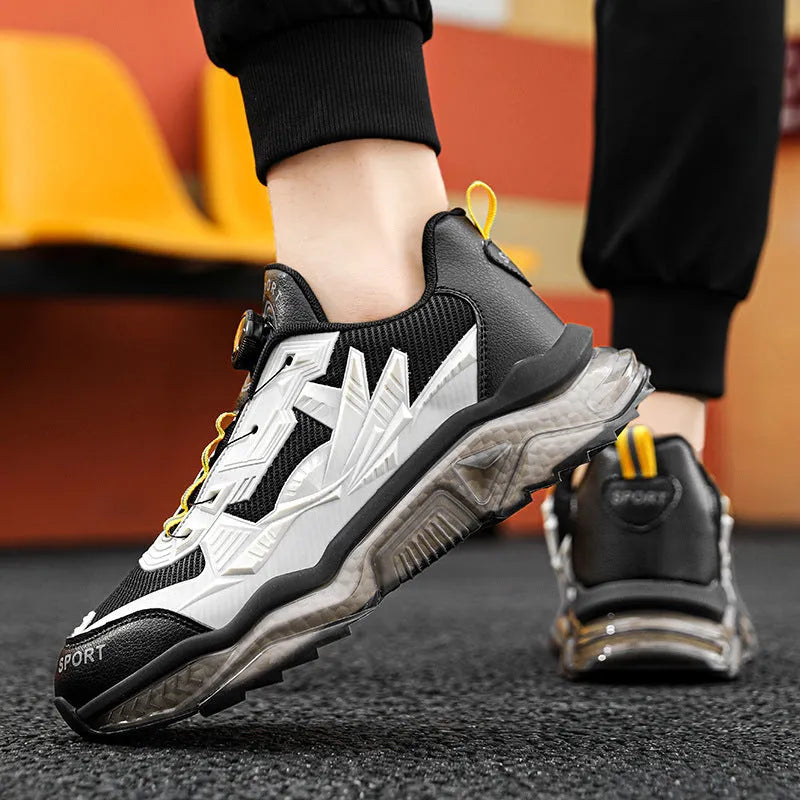 Men's black casual shoes with rotating button fastener and mesh upper on a rubber platform sole.