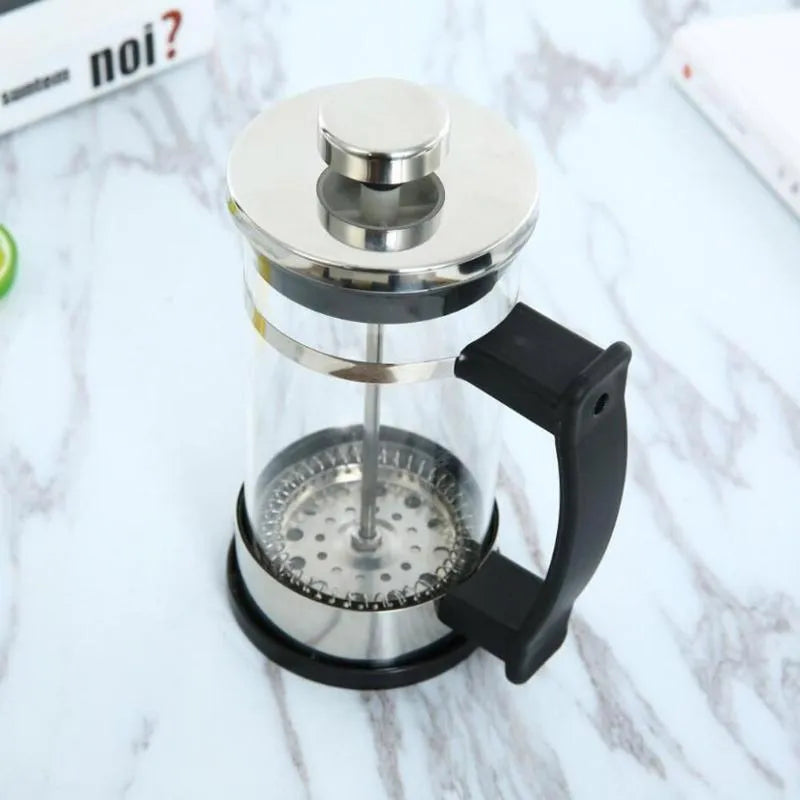 Compact glass and stainless steel coffee maker with 350ml capacity and pour-over design