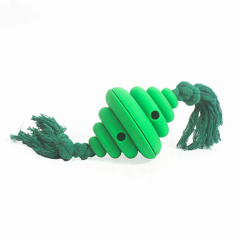 Green and yellow dog ball with rope toy showing split oval spiral design and integrated rope handle
