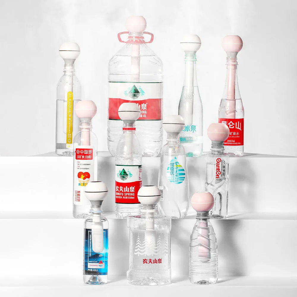 Pink and white columnar magic wand humidifier with USB cable and 1 litre water tank.