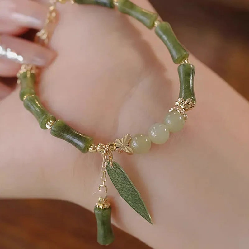 Chinese style bamboo leaf glass bracelet for women with a bamboo joint design.