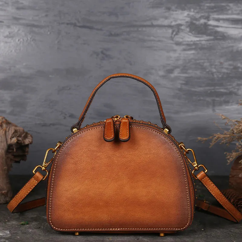 Vintage suede cowhide leather handbag showing internal ID pocket, phone pocket, and zipper compartments.