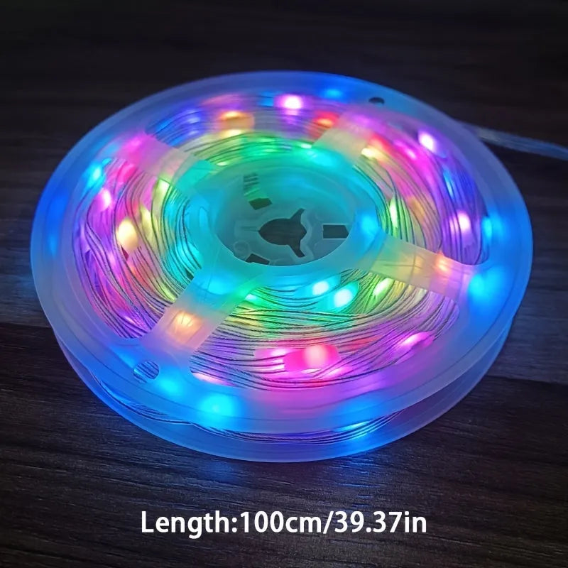 10-metre long multi-colour LED light string with 100 bulbs coiled on a table.