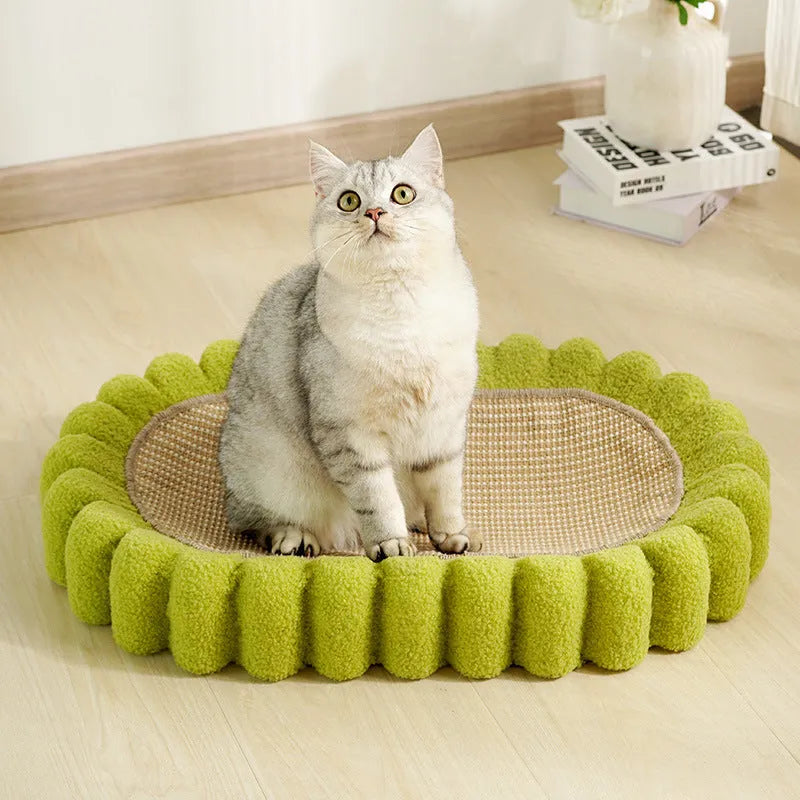 Green oval cat scratching pad with sisal surface measuring 65cm long, functioning as both scratcher and lounger bed
