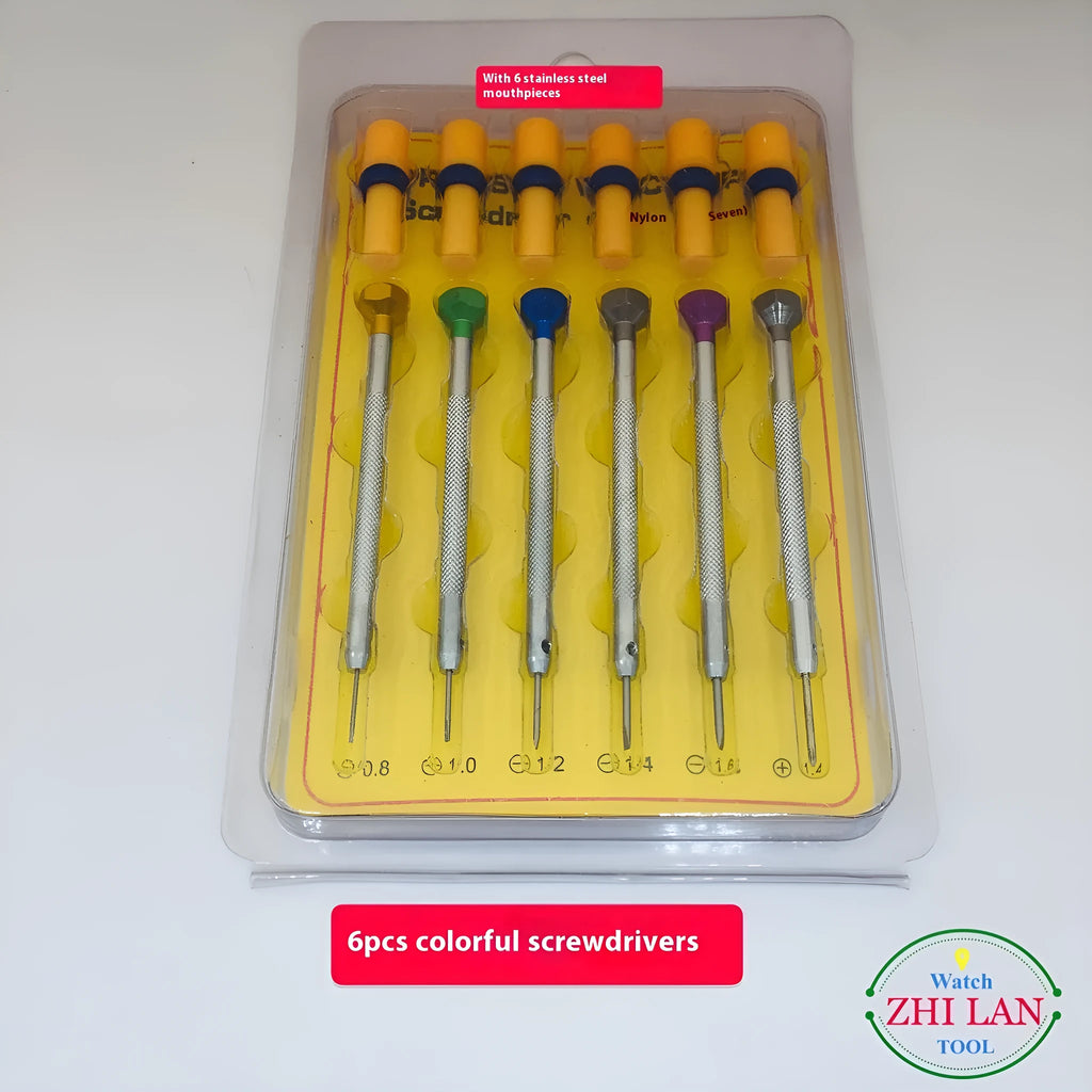 Six colour-coded watch repair screwdrivers with copper handles stored in an open aluminium case.